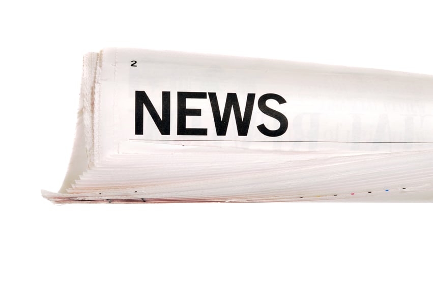 news-headline-rolled-paper